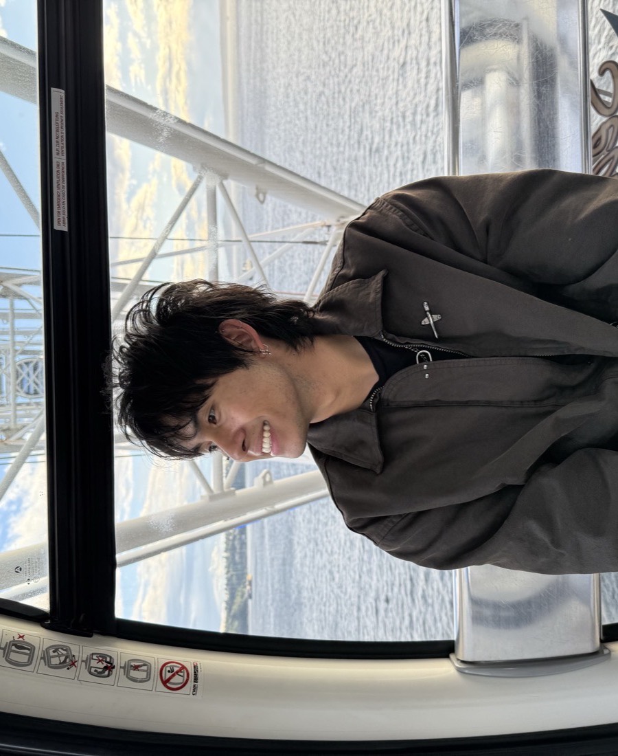 Justis Peppin in a Seattle Great Wheel gondola, looking out over Elliott Bay.