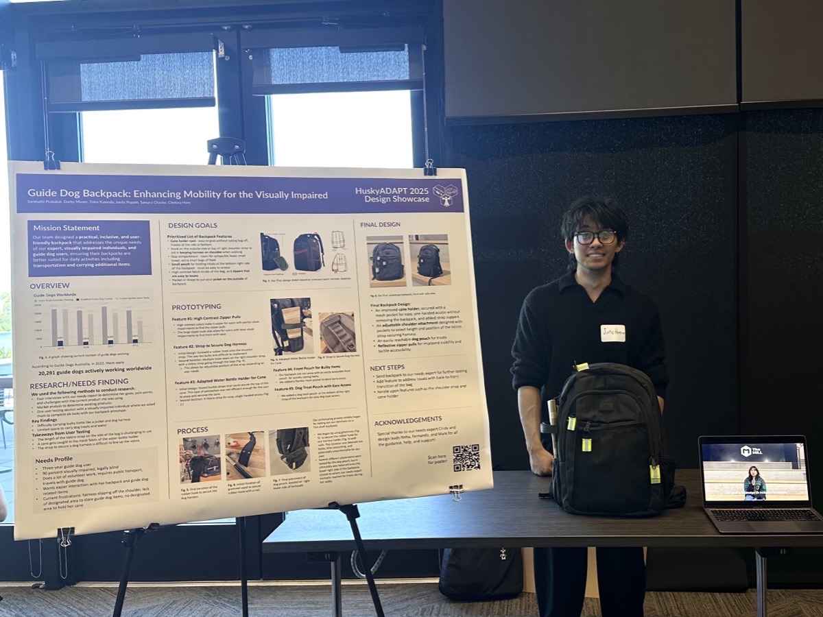 Justis Peppin standing beside the HuskyADAPT guide dog backpack and its RESNA 2025 design showcase poster.